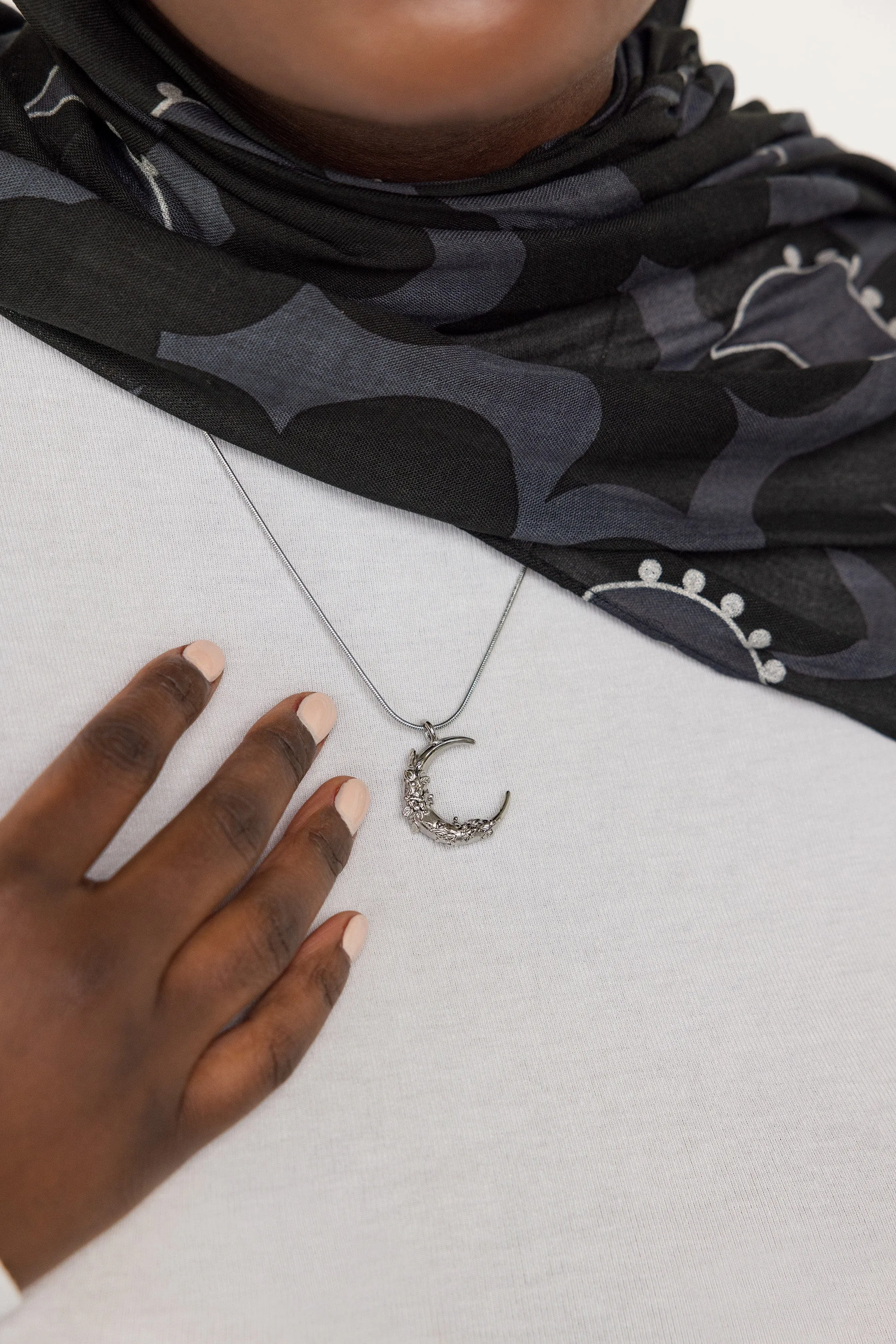 Crescent Shaped Jasmine Necklace by VELA and Nominal